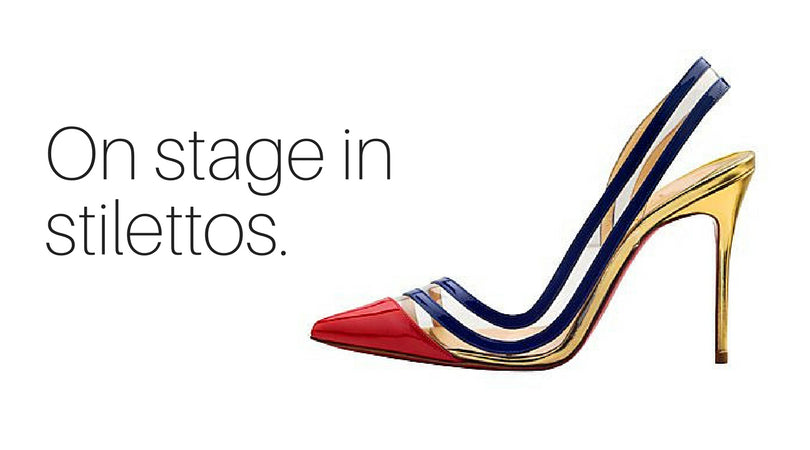 Successfully speak on stage in stilettos.
